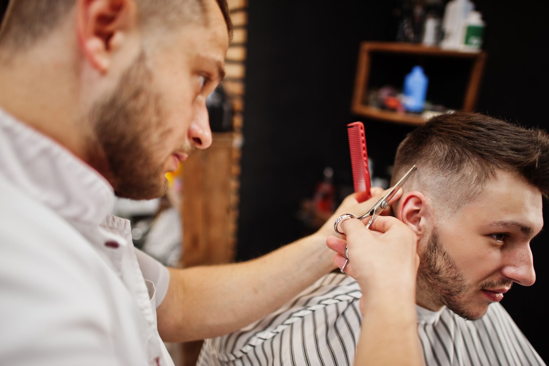 A barbershop service during a busy day with online bookings and returning clients.